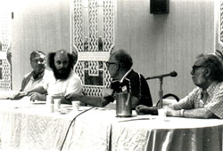 E.J. Gold, with big hair, serving on a Science Fiction convention panel with Isaac Asimov, right