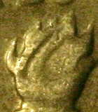 Detail of 1970 dime showing an anomaly in the flame area