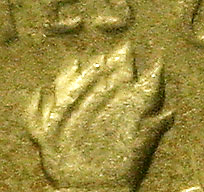 Detail of 1970 dime showing an anomaly in the flame area