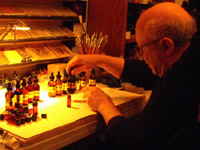 Photo of E.J. Gold working on the essential oil blend, End of Life
