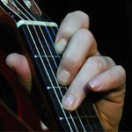 Guitar fingering for C chord by E.J. Gold